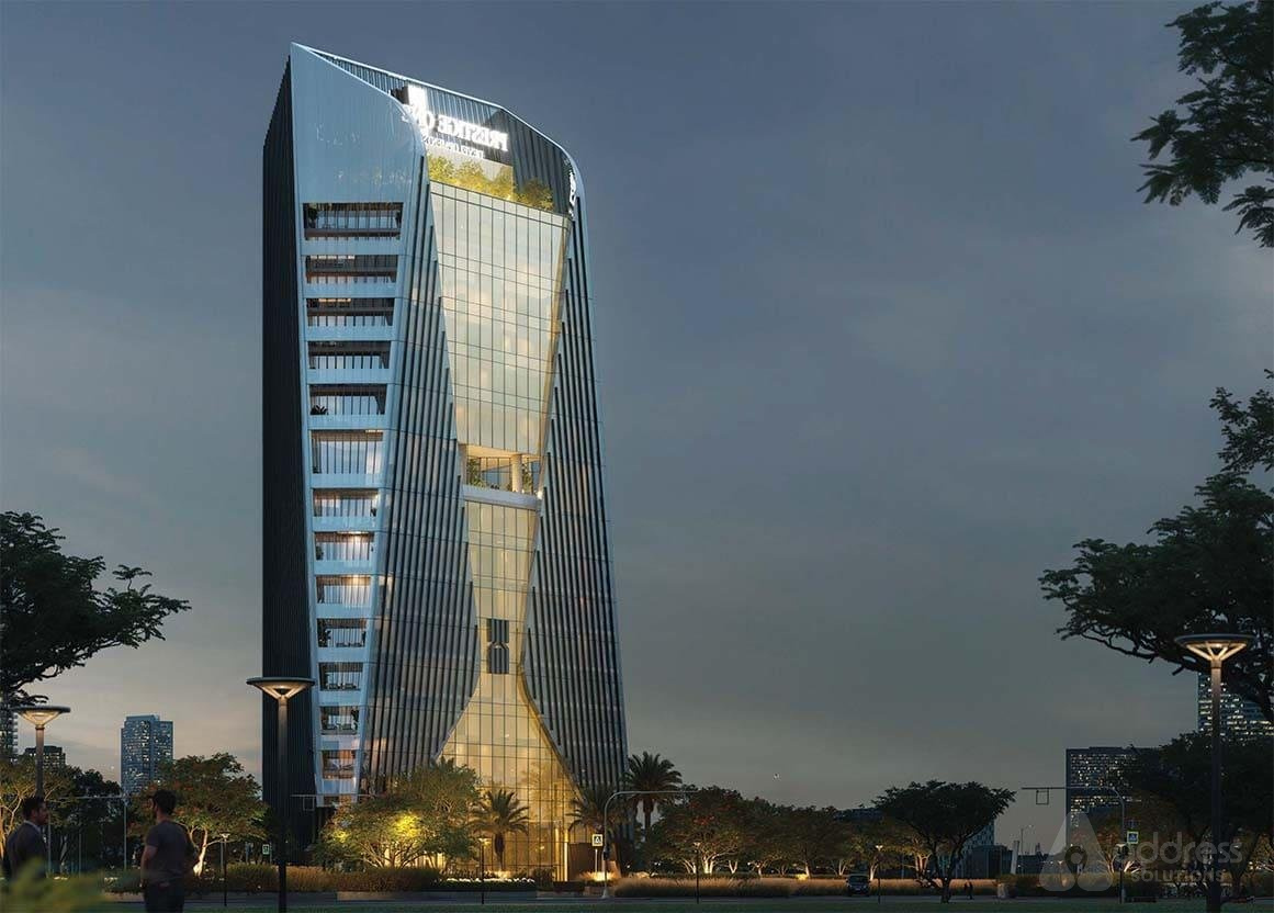 Modern commercial office tower at night